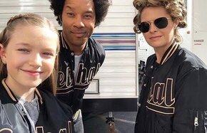 Celebrities In Matching Black And Gold Varsity Jackets
