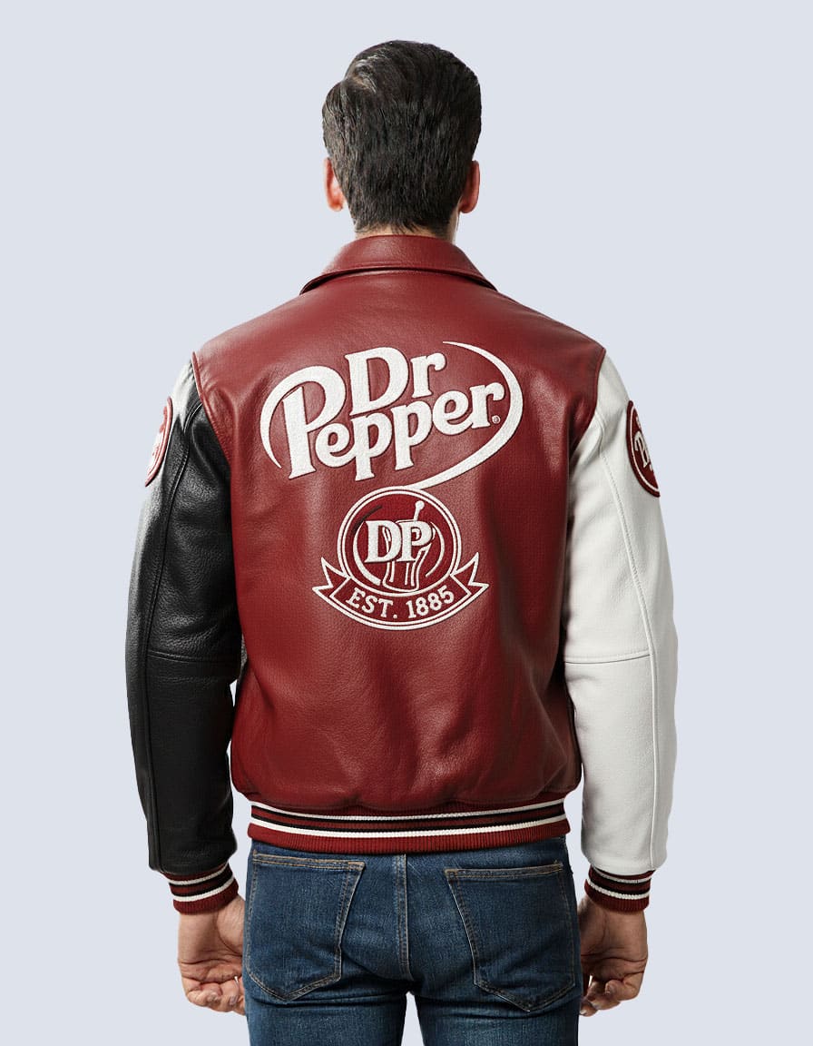 Corporate varsity jacket in black and gold with embroidered brand logo for staff uniforms