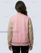 Back view of women’s baby pink and beige wool varsity jacket showing color block sleeves